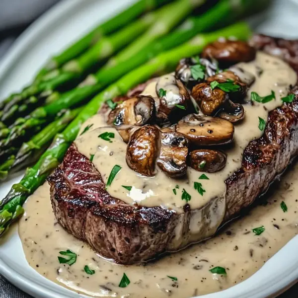 Ribeye Steak with Creamy Mushroom Sauce and Asparagus